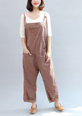 Women's geometric patterned bib jumpsuit with adjustable straps, pockets and cropped wide legs