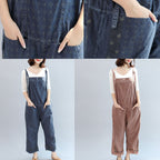 Women's geometric patterned bib jumpsuit with adjustable straps, pockets and cropped wide legs