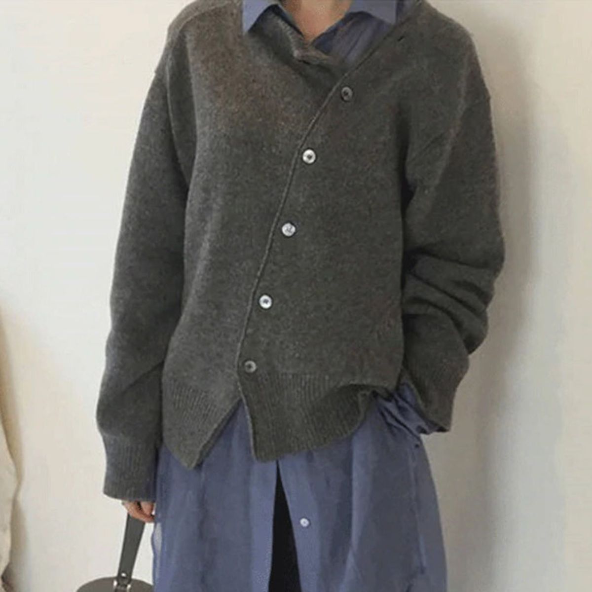 Women's asymmetric knitted cardigan with button front and long sleeves