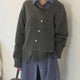 Women's asymmetric knitted cardigan with button front and long sleeves
