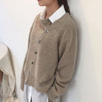 Women's asymmetric knitted cardigan with button front and long sleeves