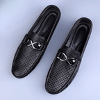 Perforated loafers with buckle detail and flat driving sole