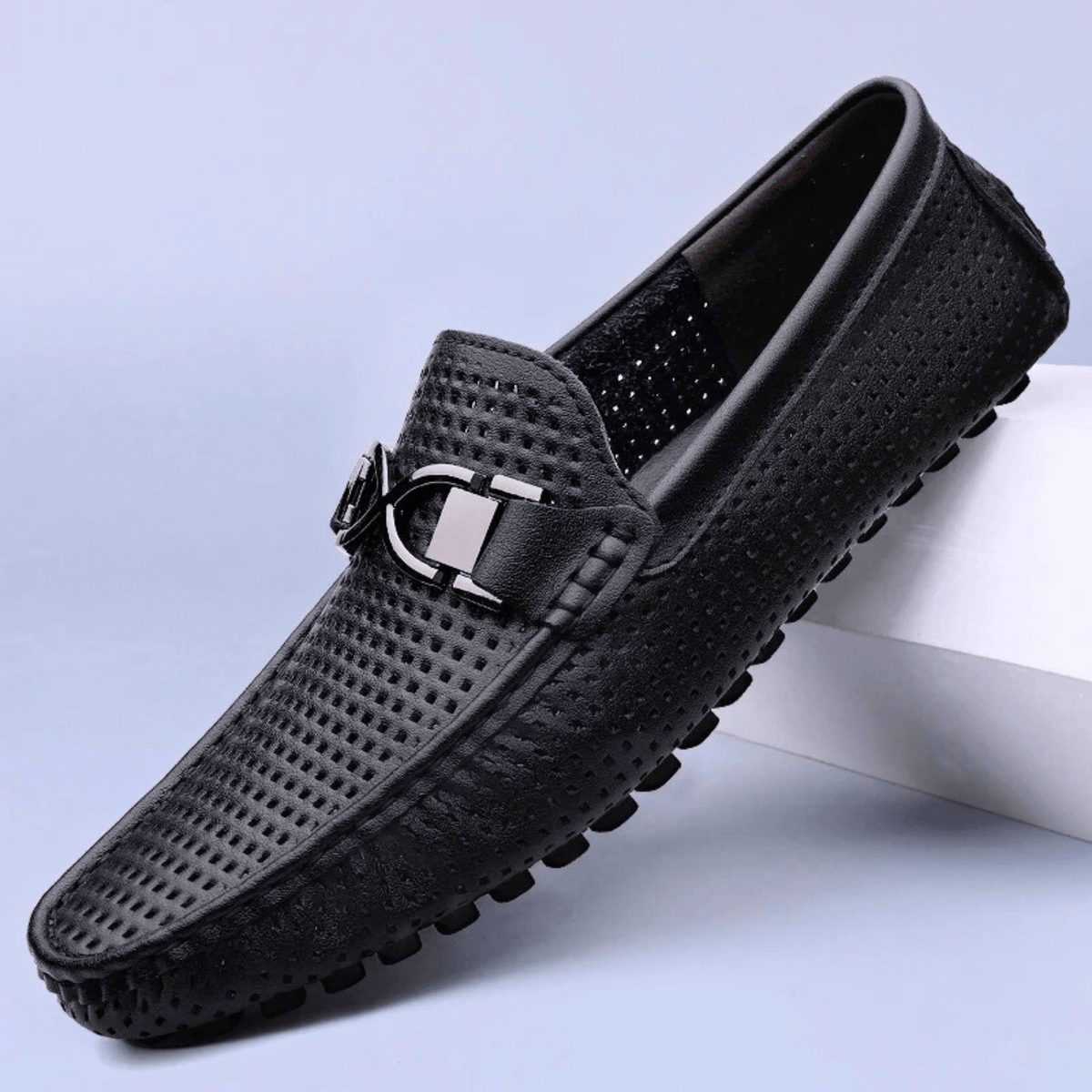 Perforated loafers with buckle detail and flat driving sole