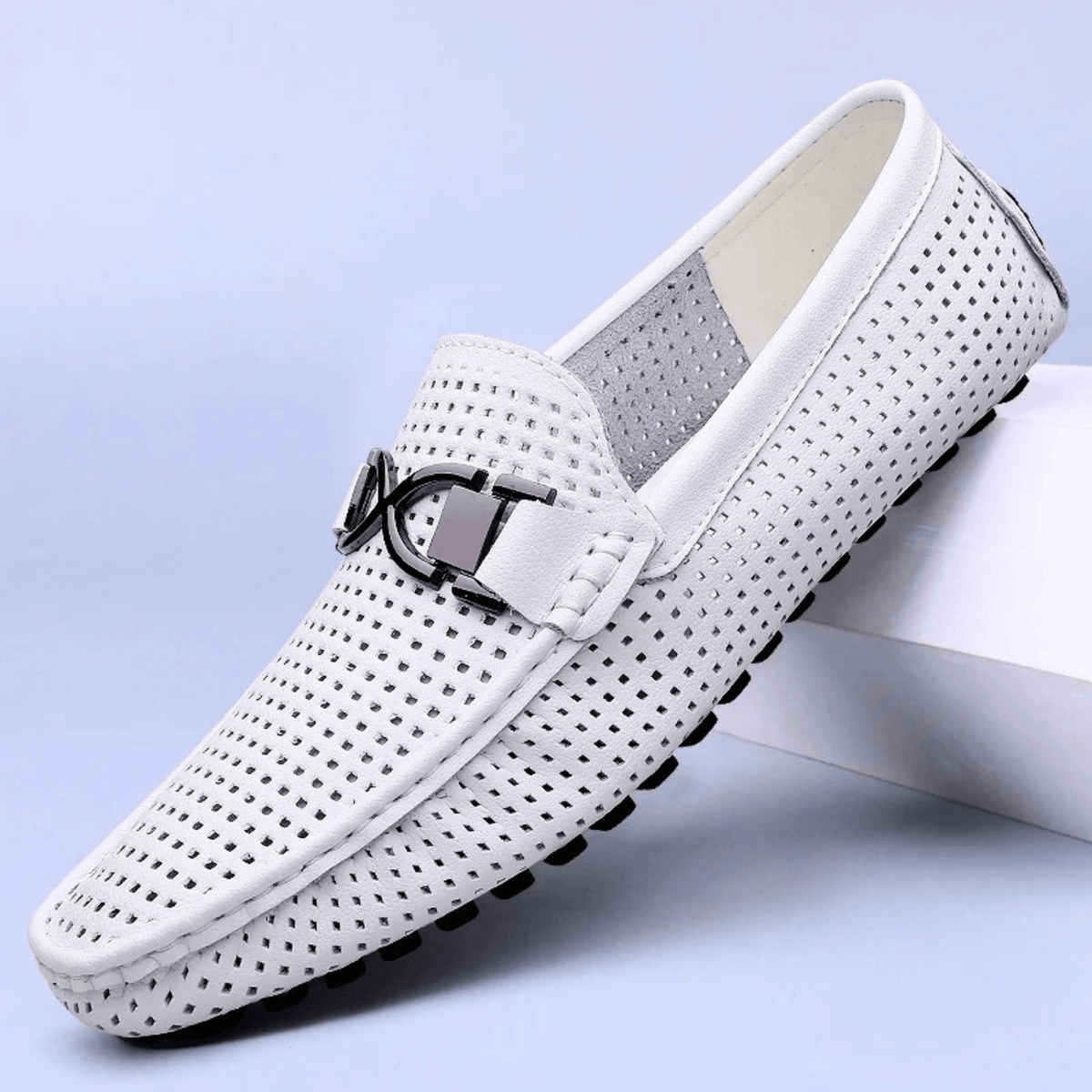 Perforated loafers with buckle detail and flat driving sole