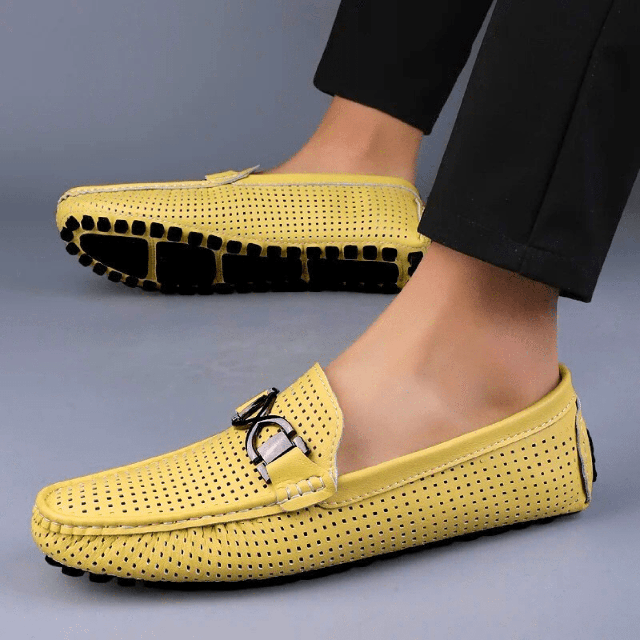 Perforated loafers with buckle detail and flat driving sole