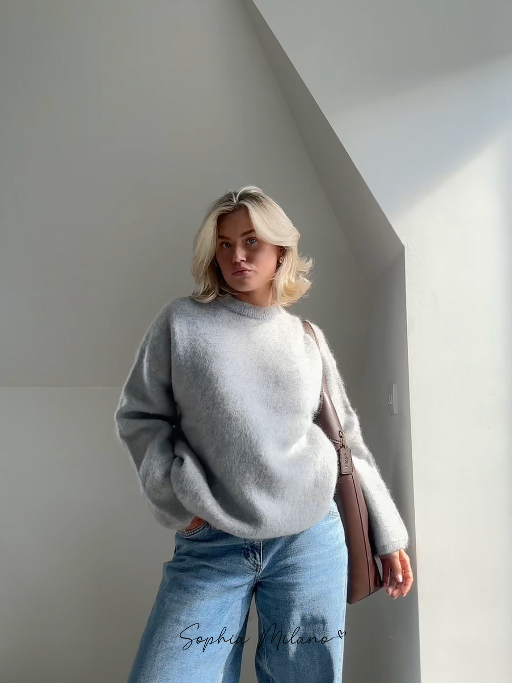 Women's relaxed crew neck sweater with long sleeves and ribbed trims