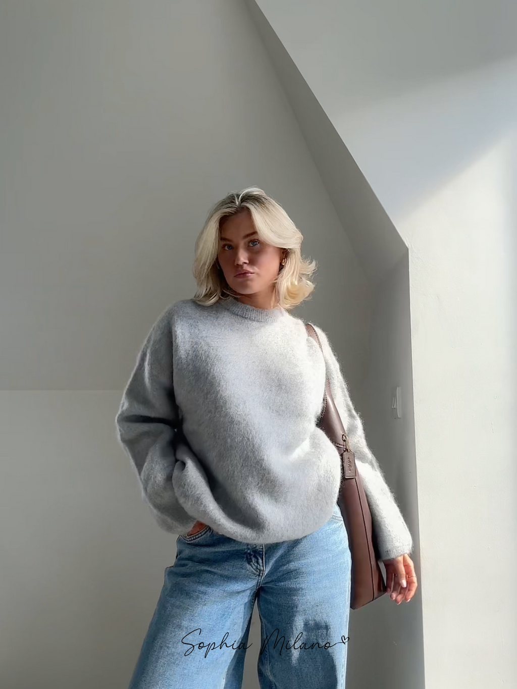 Women's relaxed crew neck sweater with long sleeves and ribbed trims
