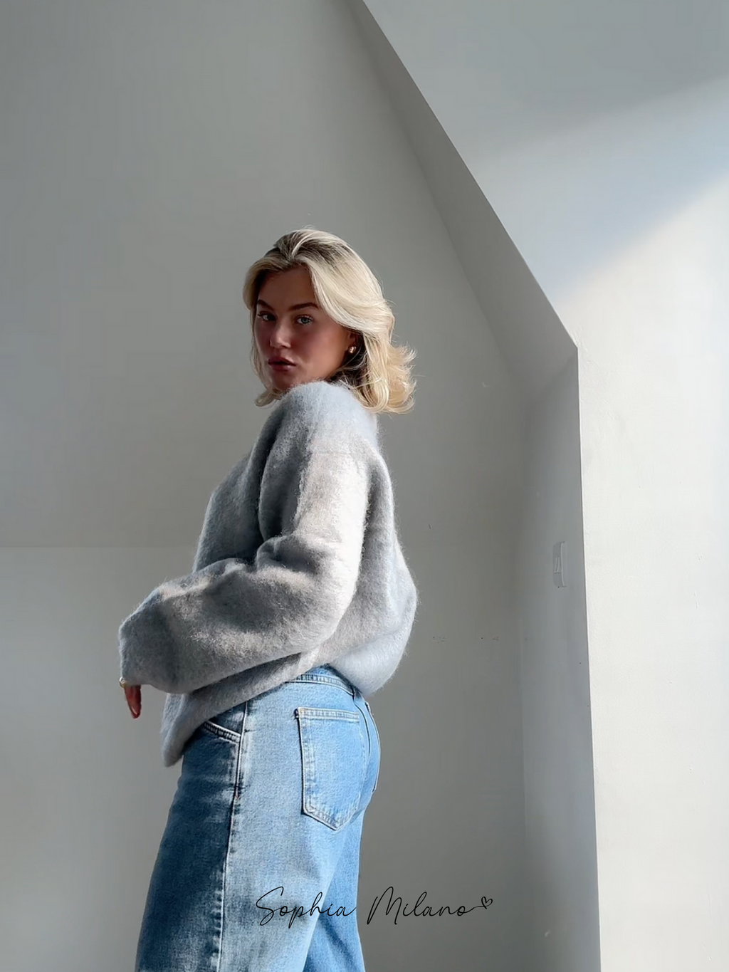 Women's relaxed crew neck sweater with long sleeves and ribbed trims
