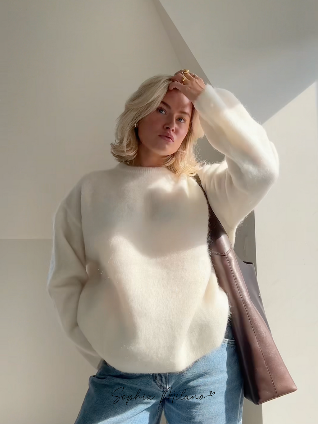 Women's relaxed crew neck sweater with long sleeves and ribbed trims