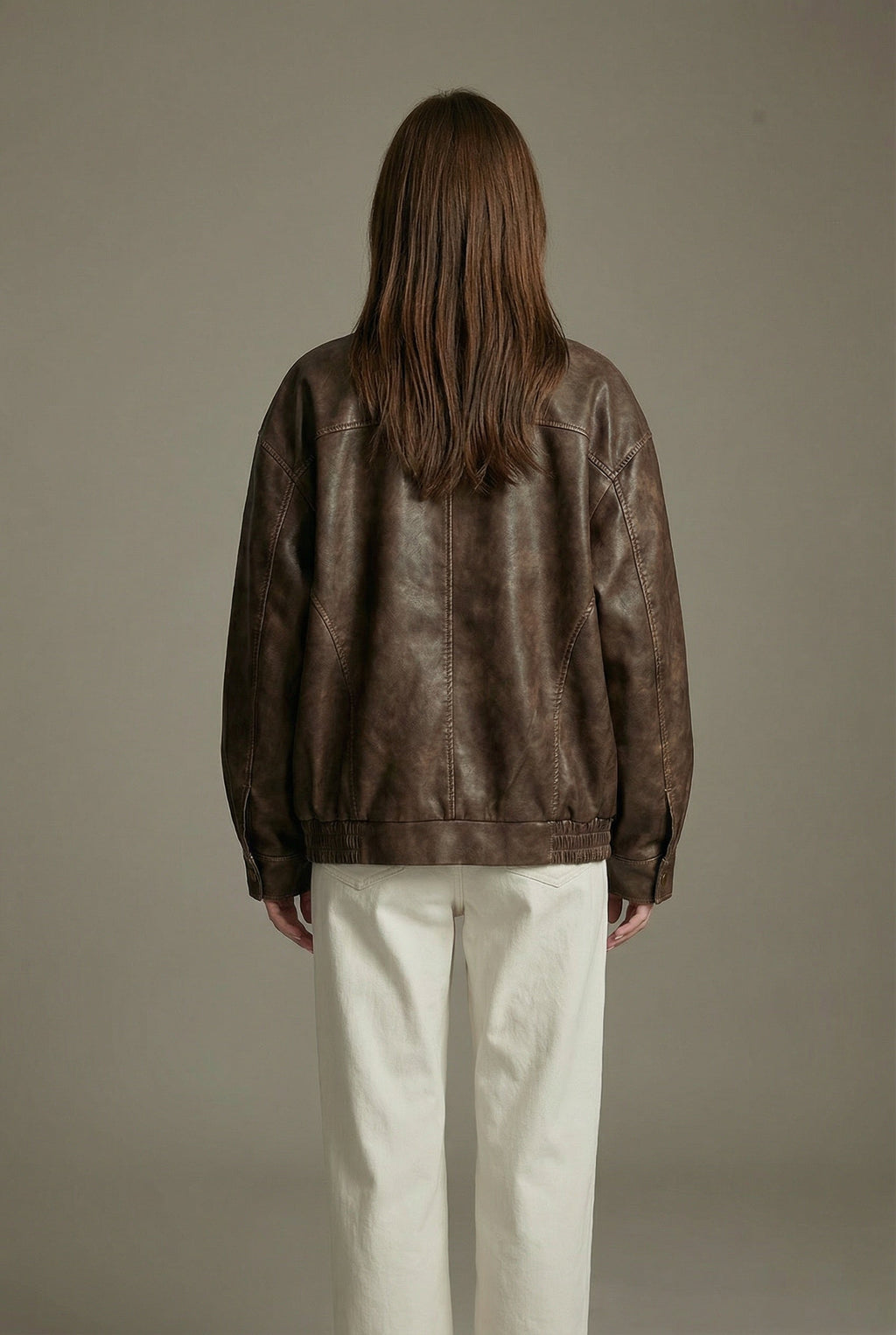 Women's oversized brown faux leather jacket with collar and zip front