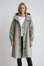 Women's long hooded trench coat with button front and gathered cuffs