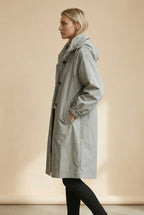 Women's long hooded trench coat with button front and gathered cuffs