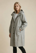 Women's long hooded trench coat with button front and gathered cuffs