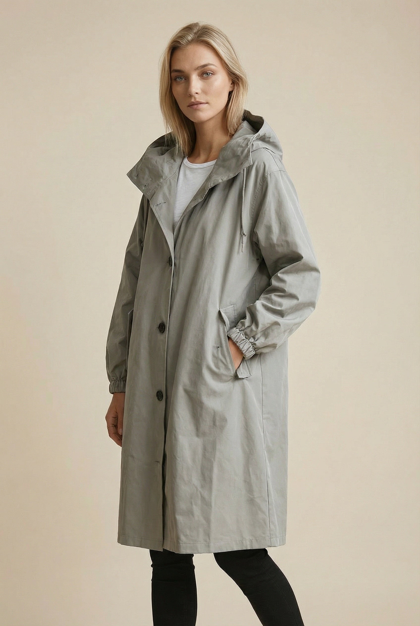 Women's long hooded trench coat with button front and gathered cuffs