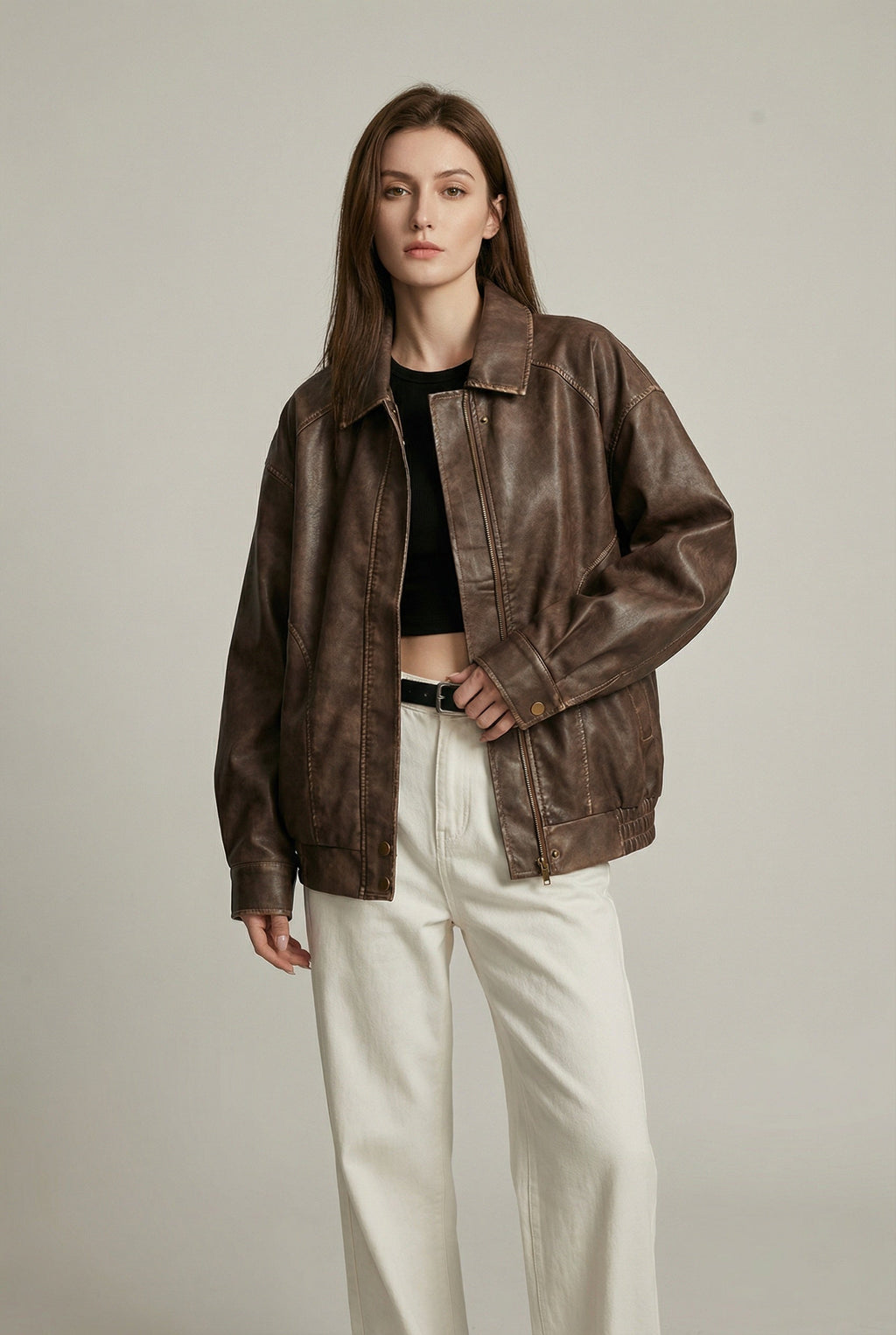 Women's oversized brown faux leather jacket with collar and zip front