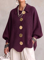 Women's oversized textured cardigan with collared neckline and large metallic buttons