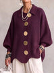 Women's oversized textured cardigan with collared neckline and large metallic buttons