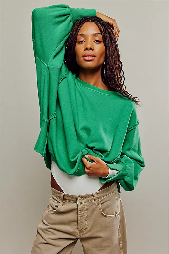Women's oversized sweatshirt with crew neckline, balloon sleeves and side slits