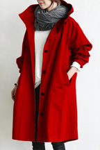 Women's oversized hooded rain parka coat with button front and elastic cuffs