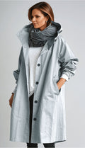 Women's oversized hooded rain parka coat with button front and elastic cuffs