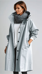 Women's oversized hooded rain parka coat with button front and elastic cuffs