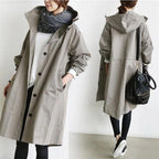 Women's oversized hooded rain parka coat with button front and elastic cuffs