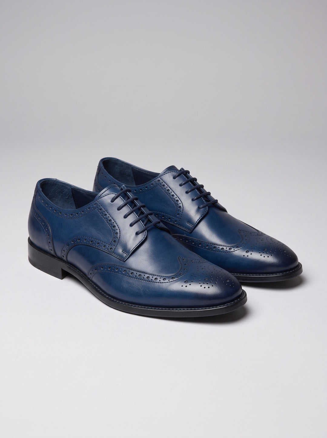 Men's leather wingtip brogue dress shoes in blue