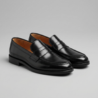 Black men's penny loafers with rounded moc toes and low heels