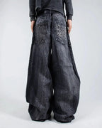 Gray wide leg jeans with frayed spiderweb detailing