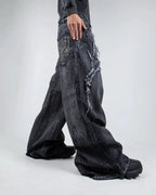 Gray wide leg jeans with frayed spiderweb detailing