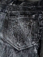 Gray wide leg jeans with frayed spiderweb detailing
