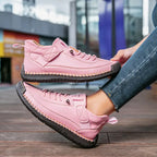 High-top sneakers with lace-up front and stitched panels