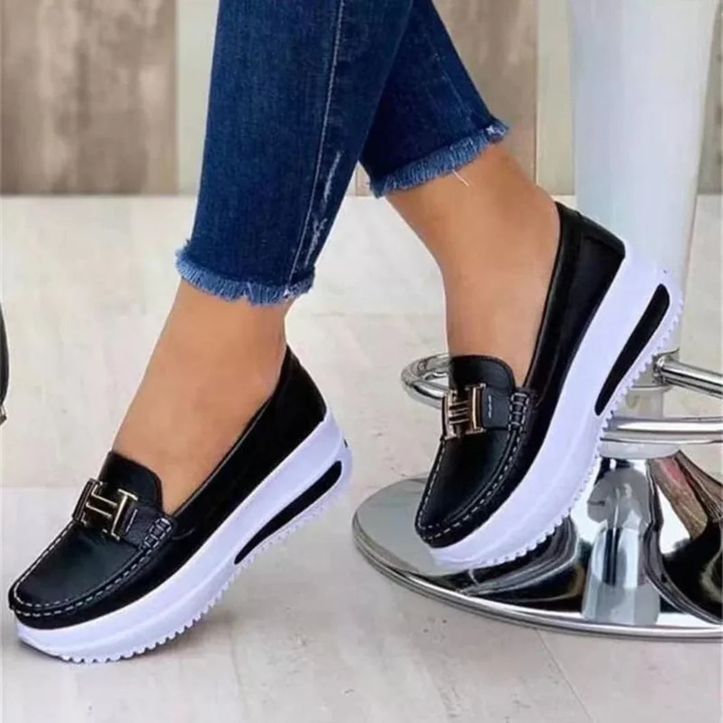 Women's platform moc-toe loafers with metal trim and raised sole