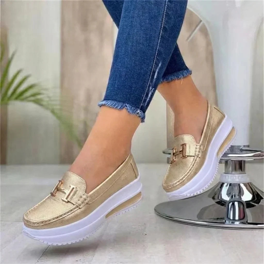 Women's platform moc-toe loafers with metal trim and raised sole