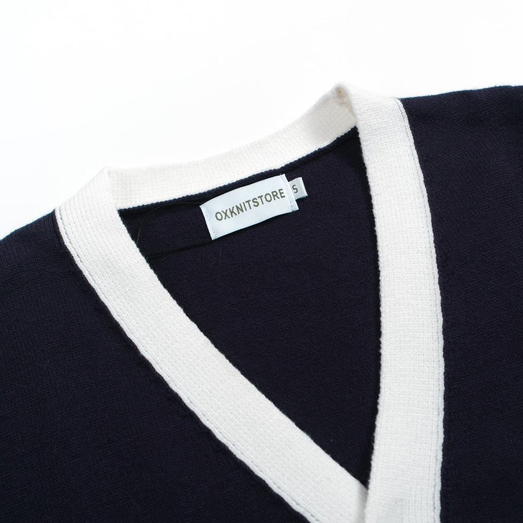 Men's navy cardigan with pale contrast trim and button front