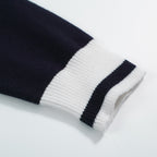 Men's navy cardigan with pale contrast trim and button front