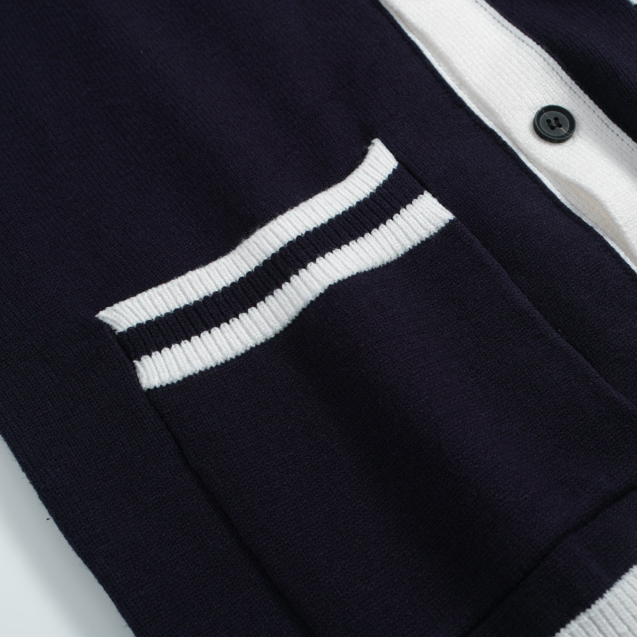 Men's navy cardigan with pale contrast trim and button front