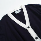 Men's navy cardigan with pale contrast trim and button front