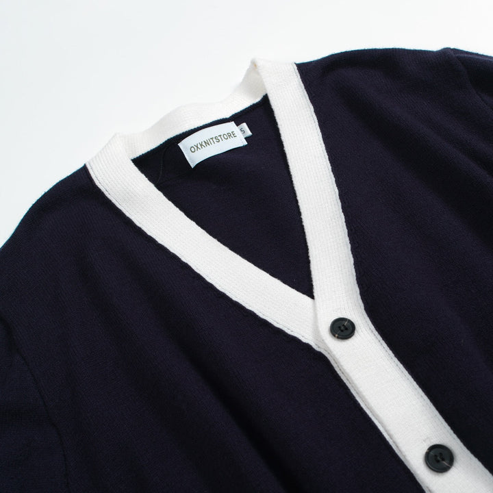 Men's navy cardigan with pale contrast trim and button front