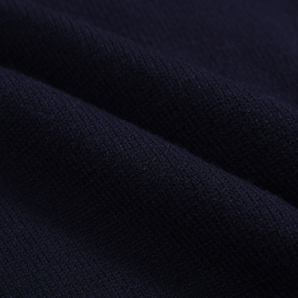 Men's navy cardigan with pale contrast trim and button front