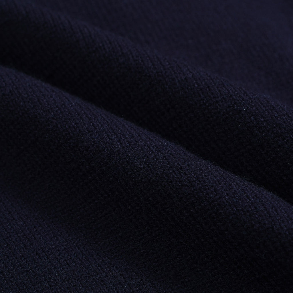 Men's navy cardigan with pale contrast trim and button front