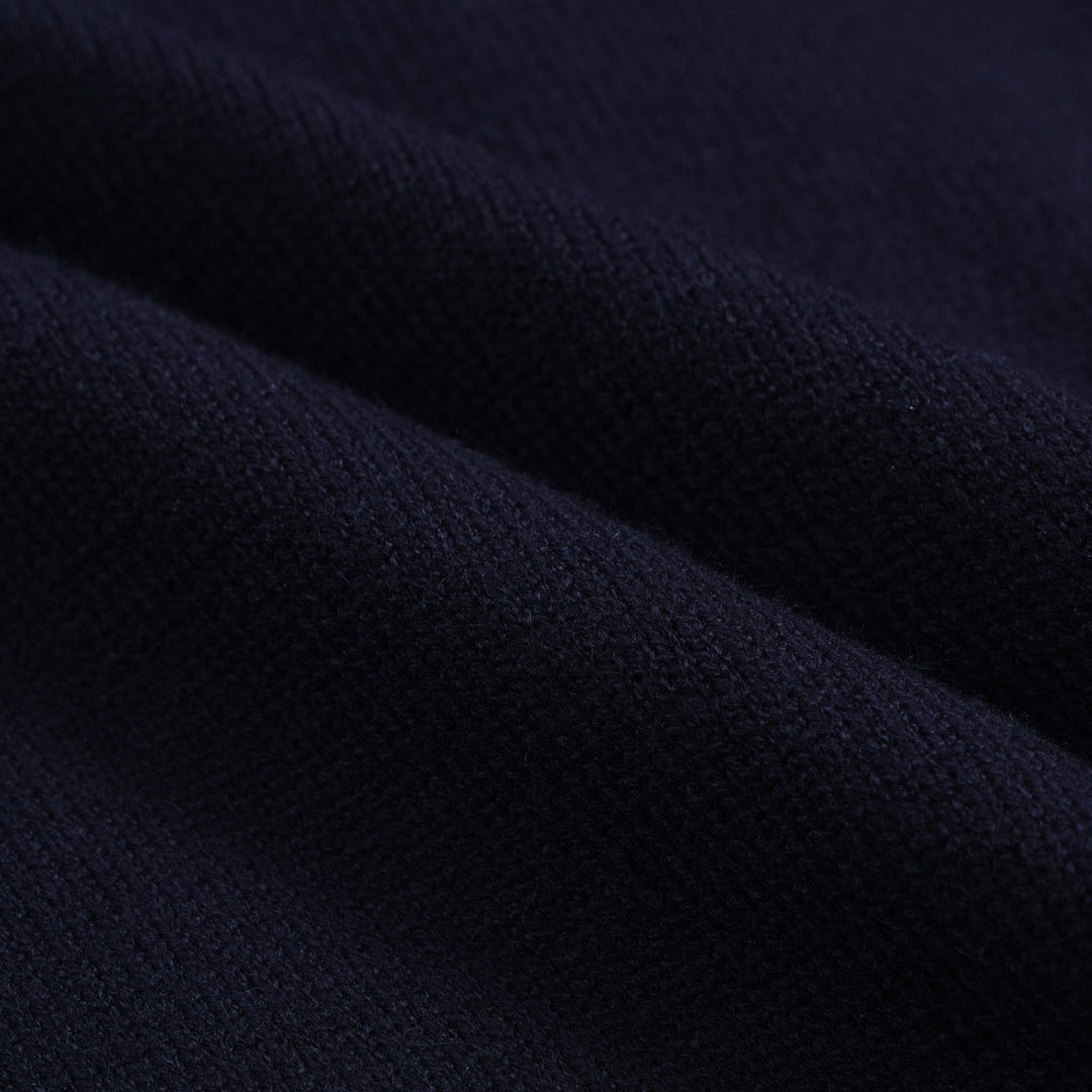 Men's navy cardigan with pale contrast trim and button front