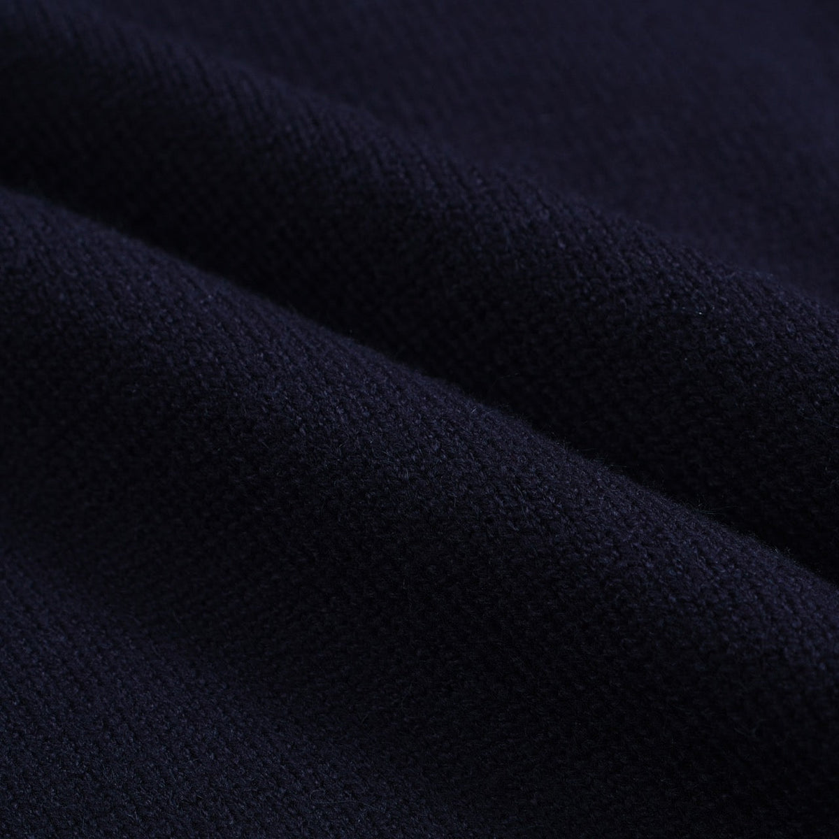 Men's navy cardigan with pale contrast trim and button front