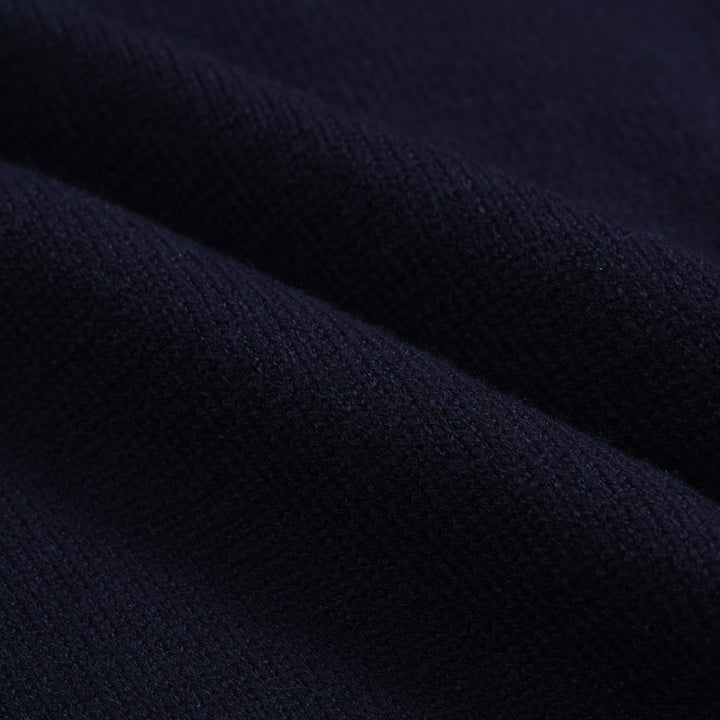 Men's navy cardigan with pale contrast trim and button front