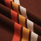 Men's brown knit polo with vertical retro stripes and short sleeves