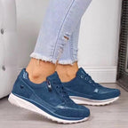 Women's low-top sneakers with laces, side zippers, metallic panels and white soles