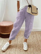 Women's cropped striped trousers with elastic waist and cuffed hems