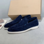 Men's slip-on loafers with textured uppers, moc toe stitching and white flat soles
