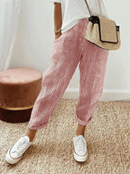 Women's cropped striped trousers with elastic waist and cuffed hems