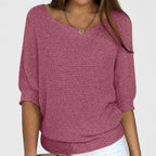 Women's textured knit pullover with round neckline and three-quarter sleeves